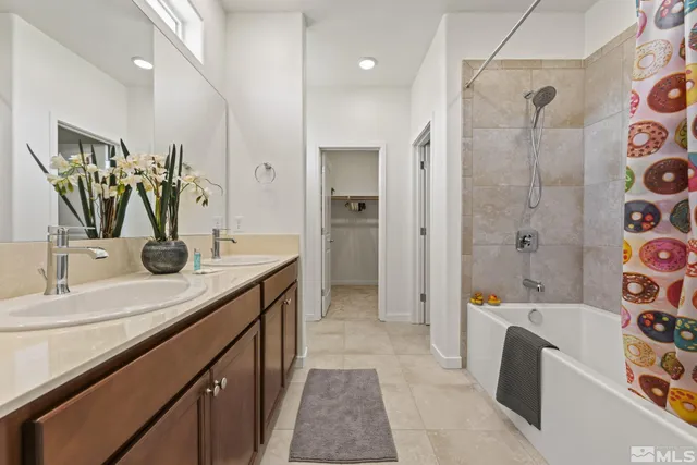 a bathroom with a tub sink and mirror