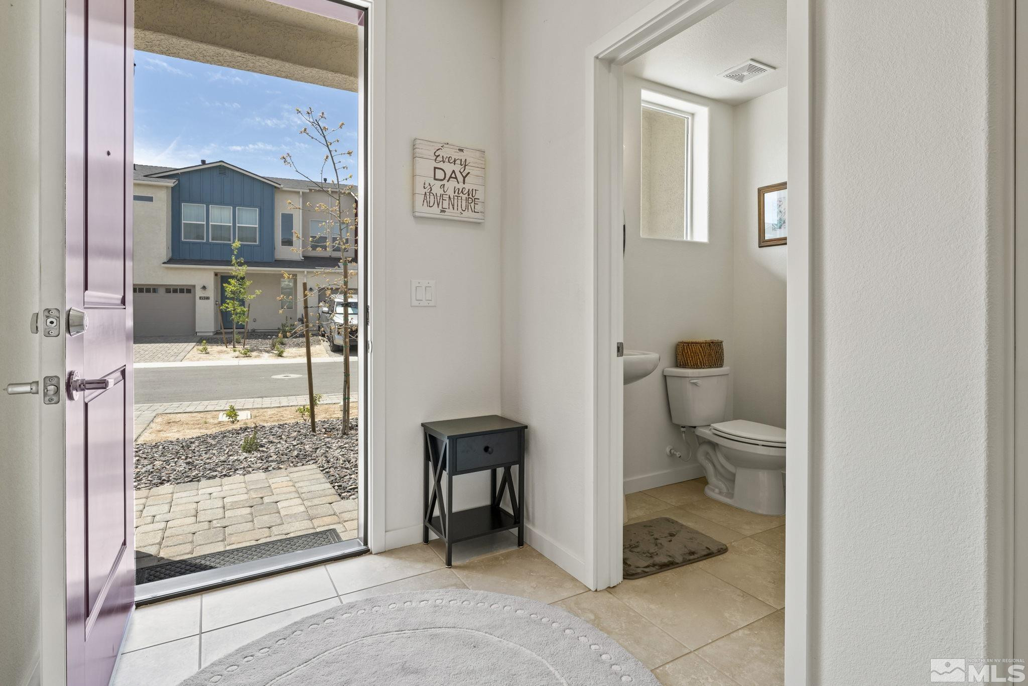 4928 Black Falcon Way Sun Valley, NV 89433 - Photo 24 of 32 a bathroom with a toilet and a shower