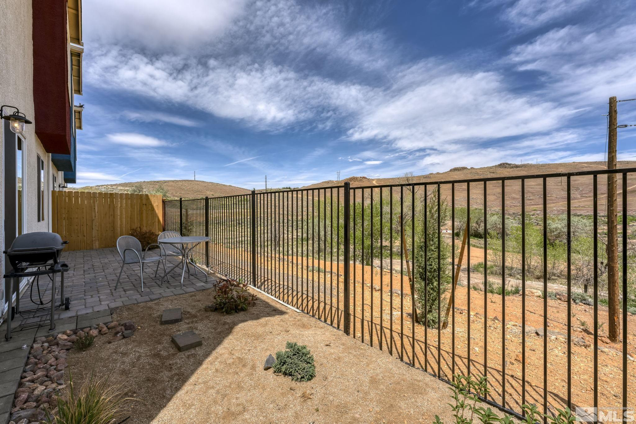 4928 Black Falcon Way Sun Valley, NV 89433 - Photo 26 of 32 a view of balcony with wooden floor