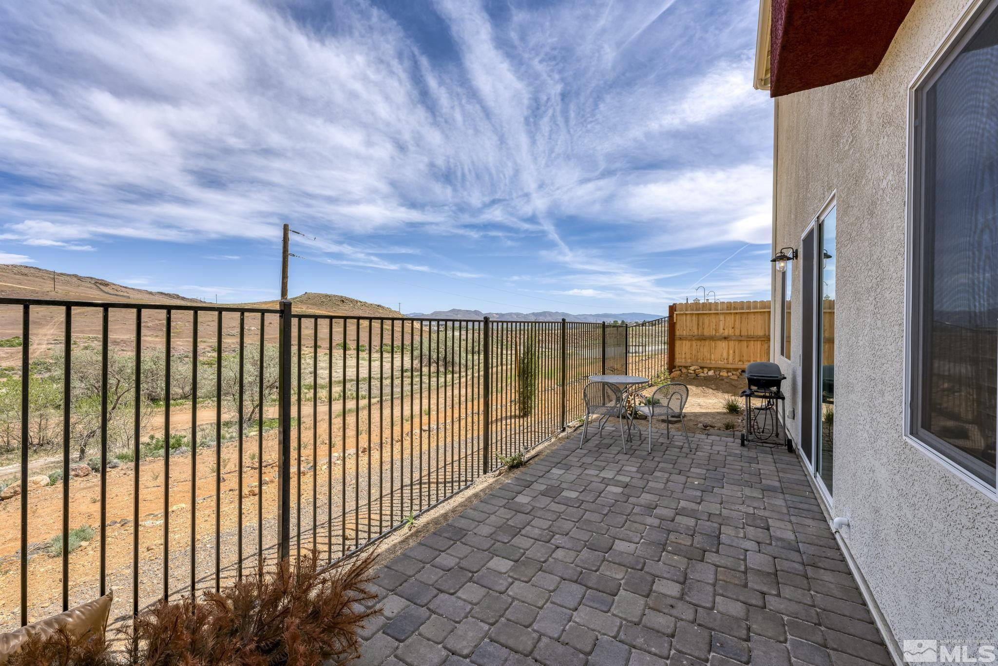 4928 Black Falcon Way Sun Valley, NV 89433 - Photo 29 of 32 a view of a balcony with chairs