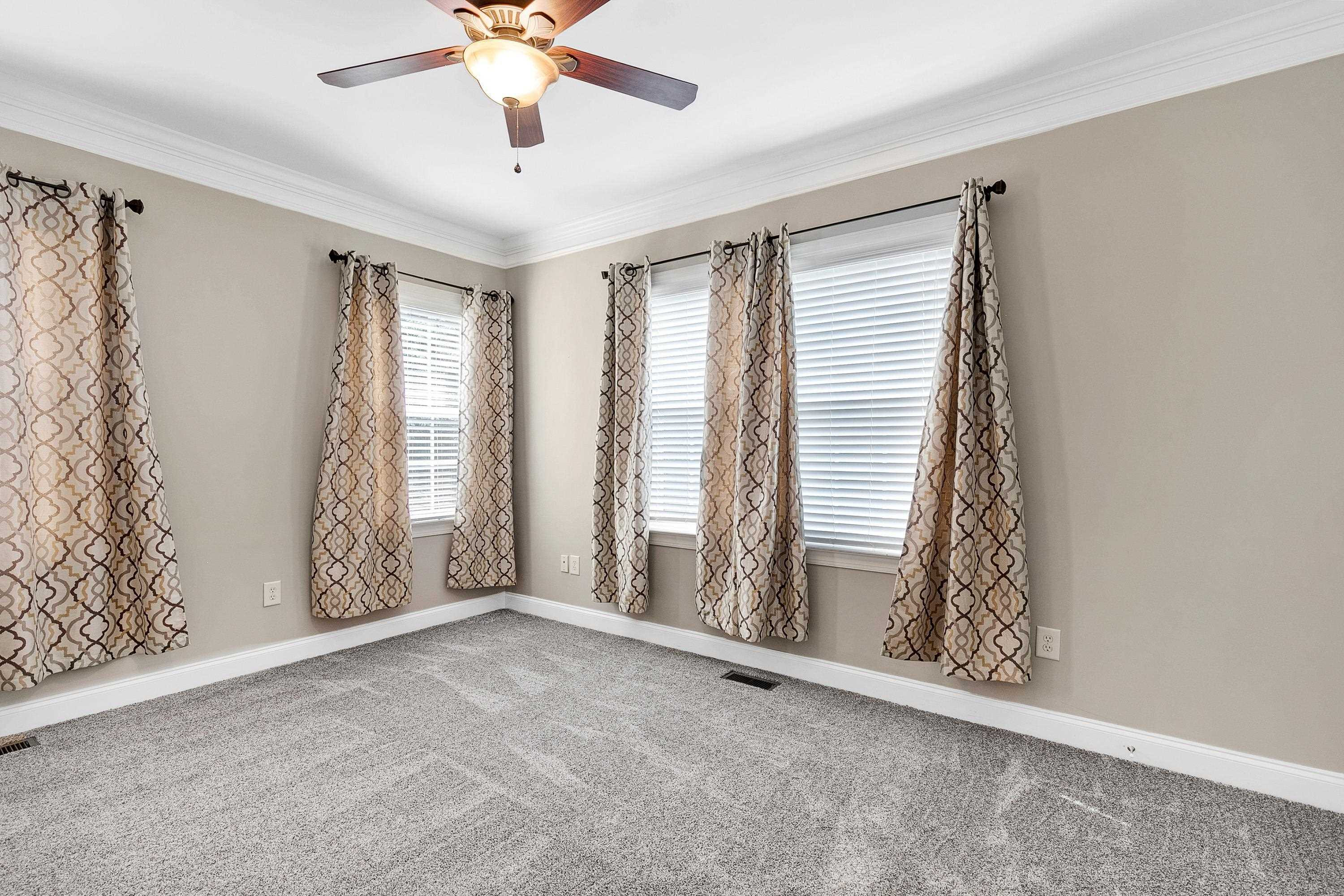 8431 Henderson Road Apex, NC 27539 - Photo 13 of 56 a view of an empty room with a window