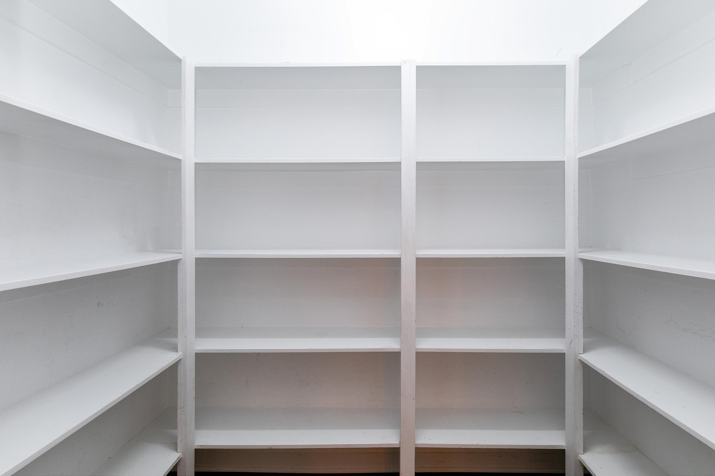 8431 Henderson Road Apex, NC 27539 - Photo 20 of 56 a view of walk in closet with empty racks