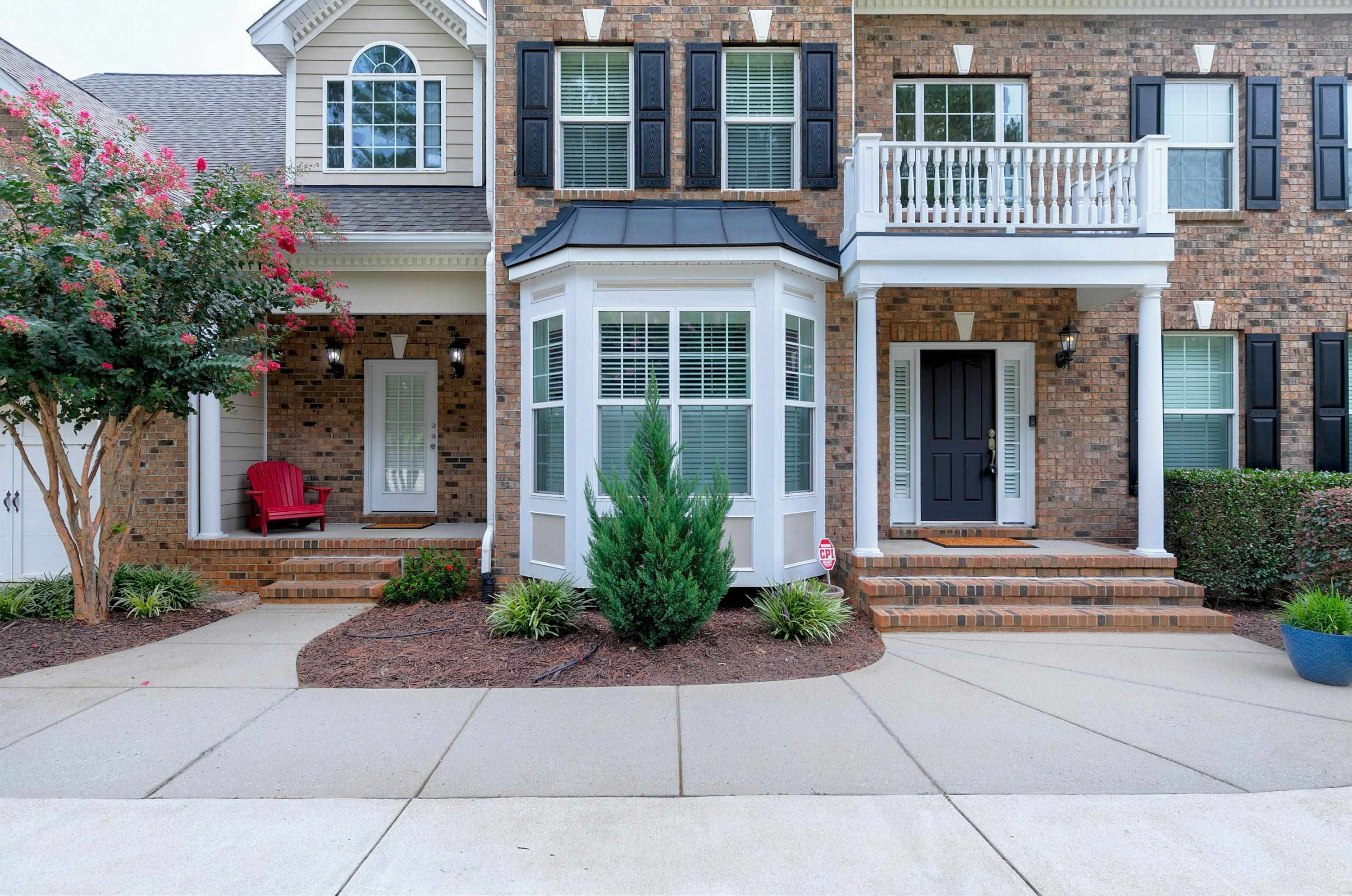 8431 Henderson Road Apex, NC 27539 - Photo 2 of 56 front view of house with a yard