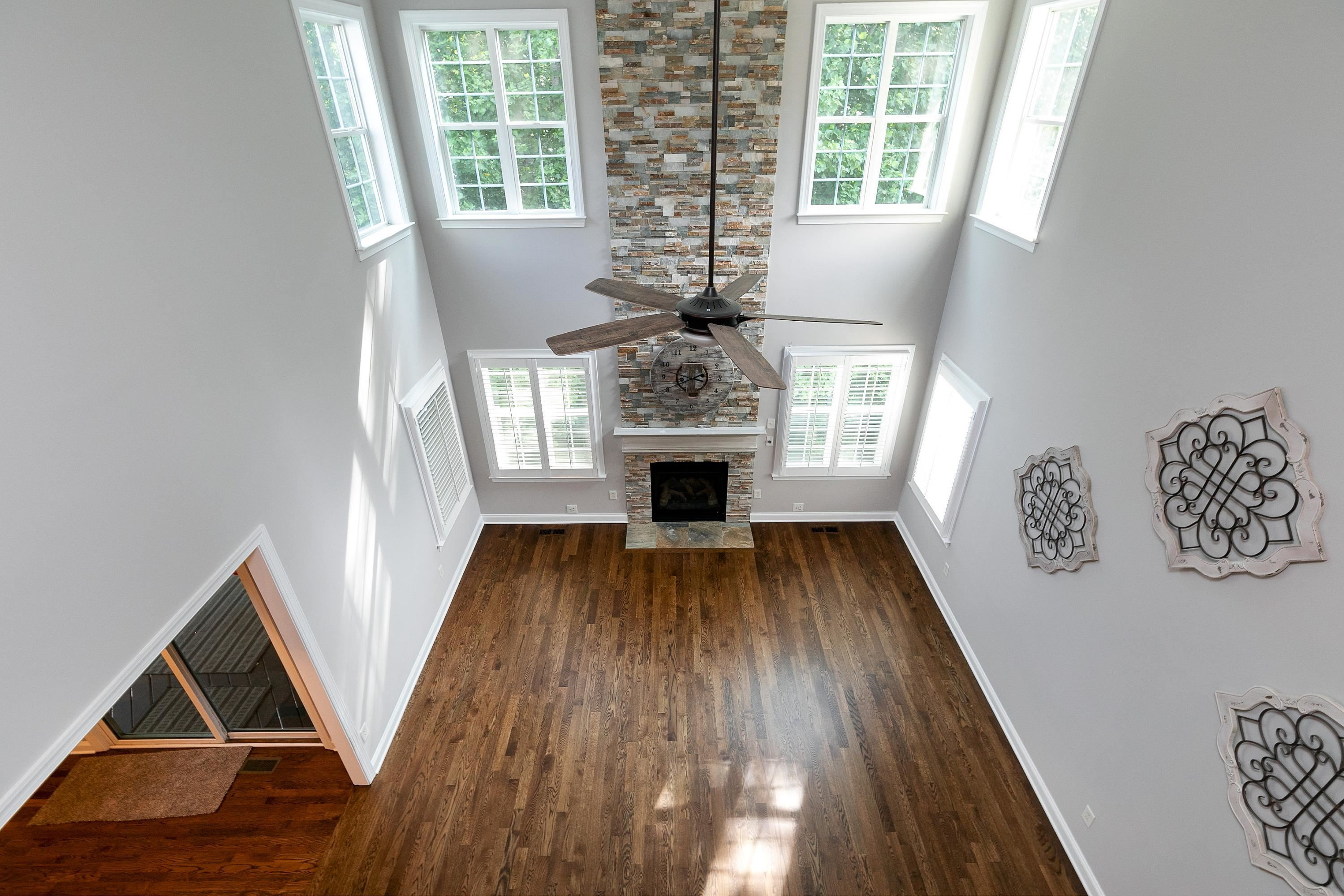 8431 Henderson Road Apex, NC 27539 - Photo 24 of 56 a view of livingroom with wooden floor and window