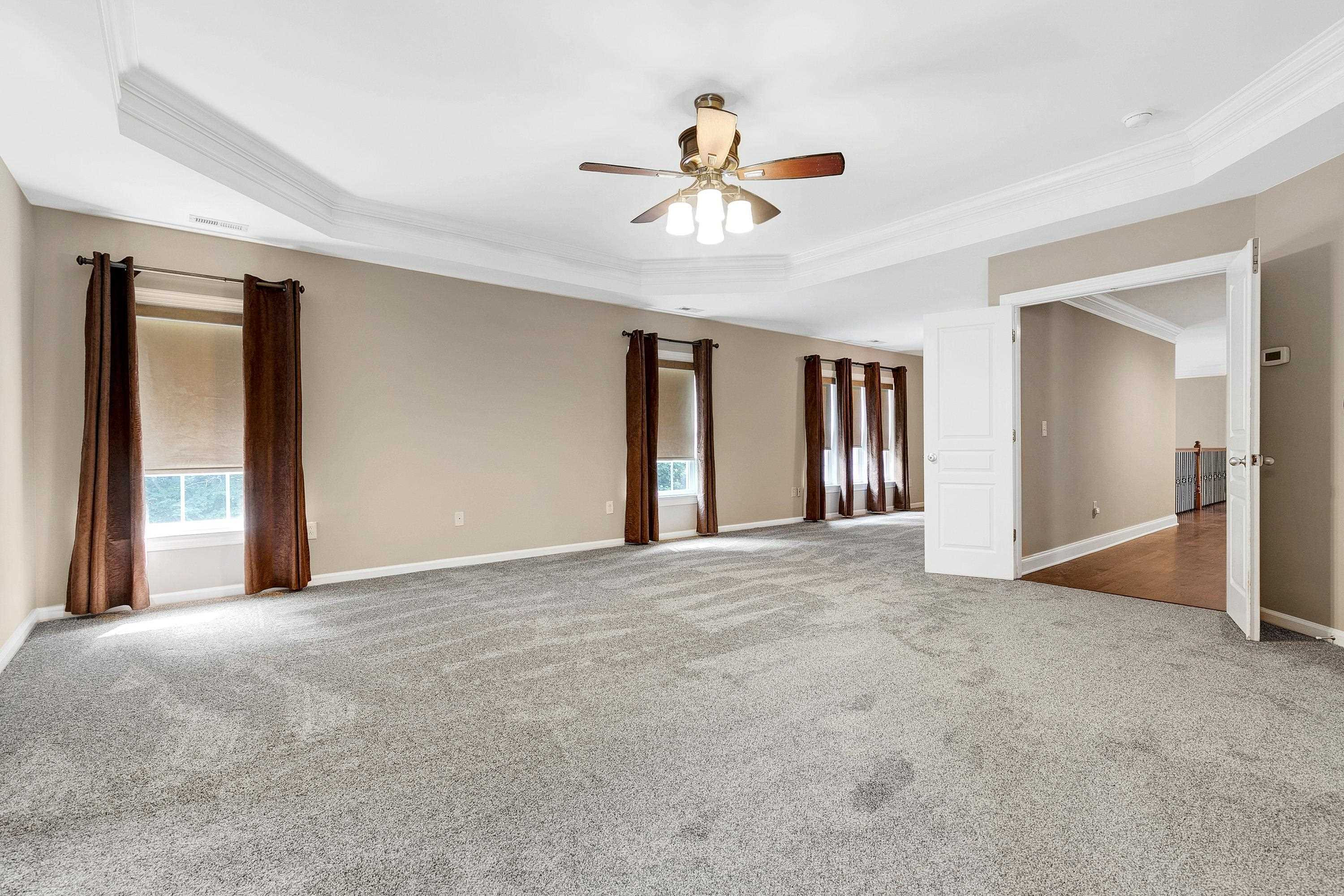 8431 Henderson Road Apex, NC 27539 - Photo 27 of 56 a view of an empty room with a window