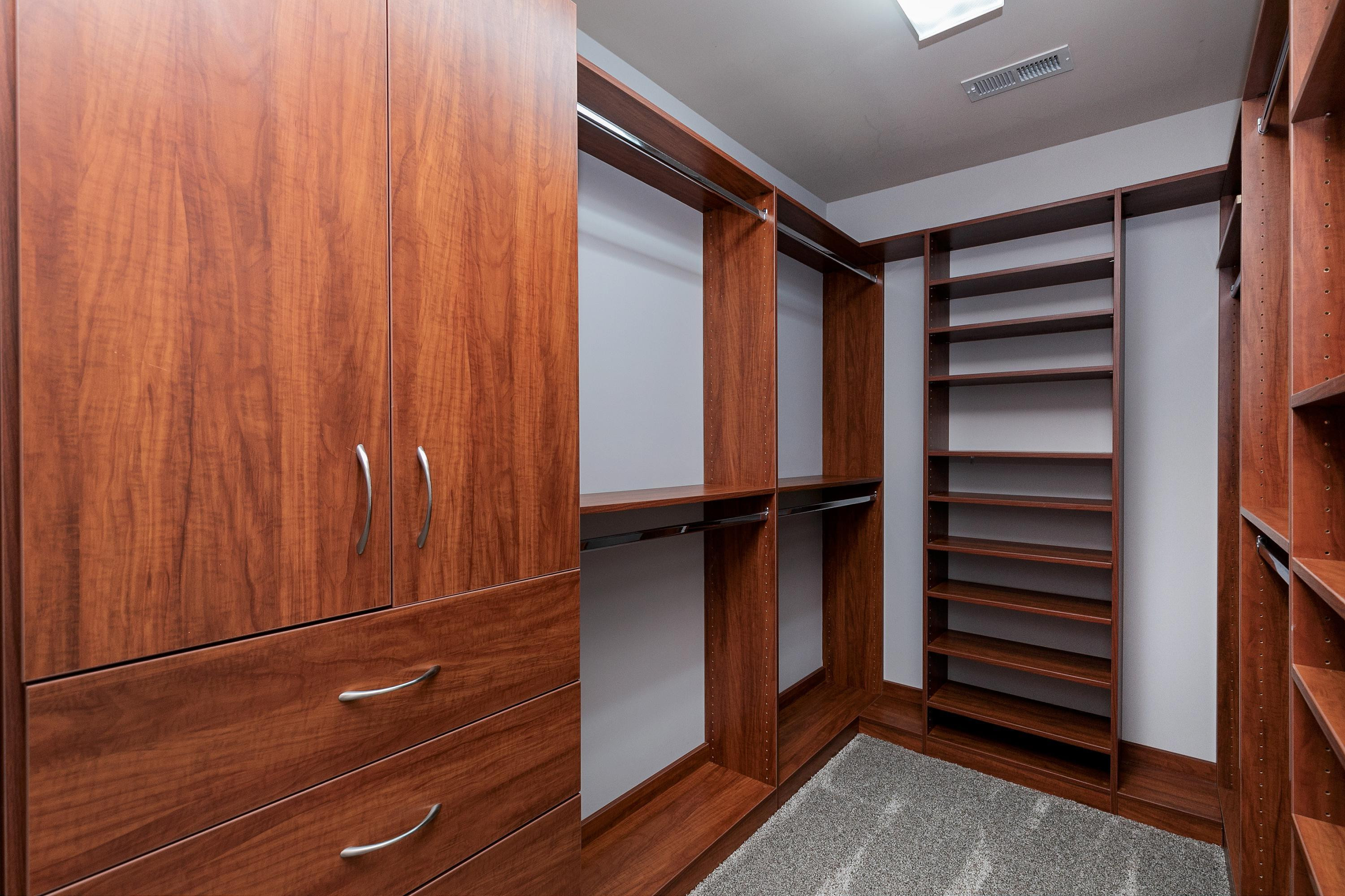 8431 Henderson Road Apex, NC 27539 - Photo 28 of 56 a view of walk in closet with empty racks
