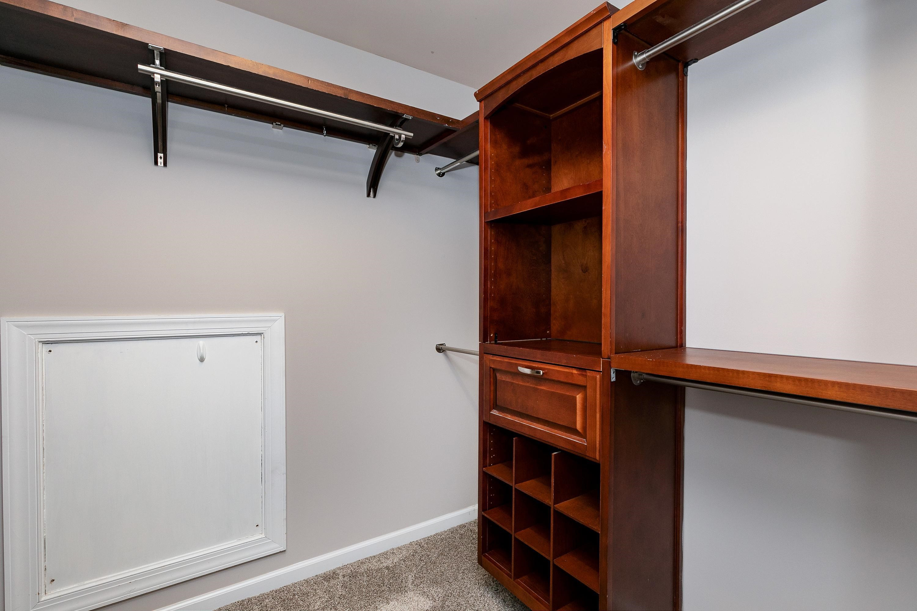 8431 Henderson Road Apex, NC 27539 - Photo 29 of 56 a view of walk in closet with empty racks