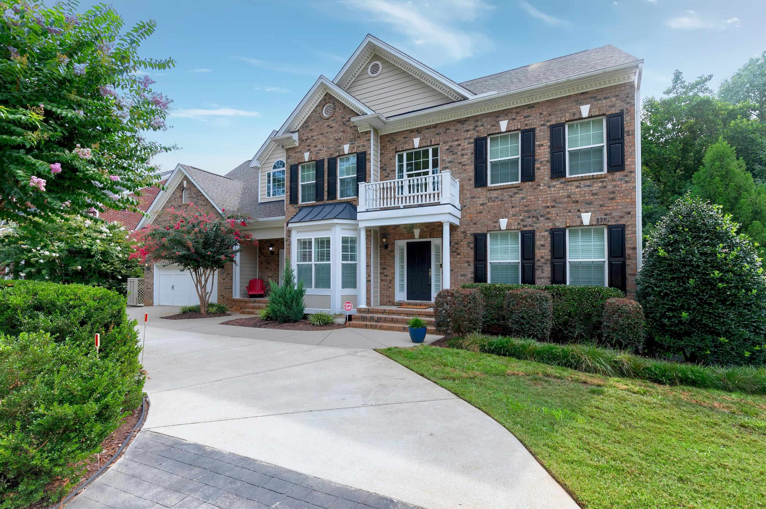 8431 Henderson Road Apex, NC 27539 - Photo 3 of 56 a front view of a house with yard and green space
