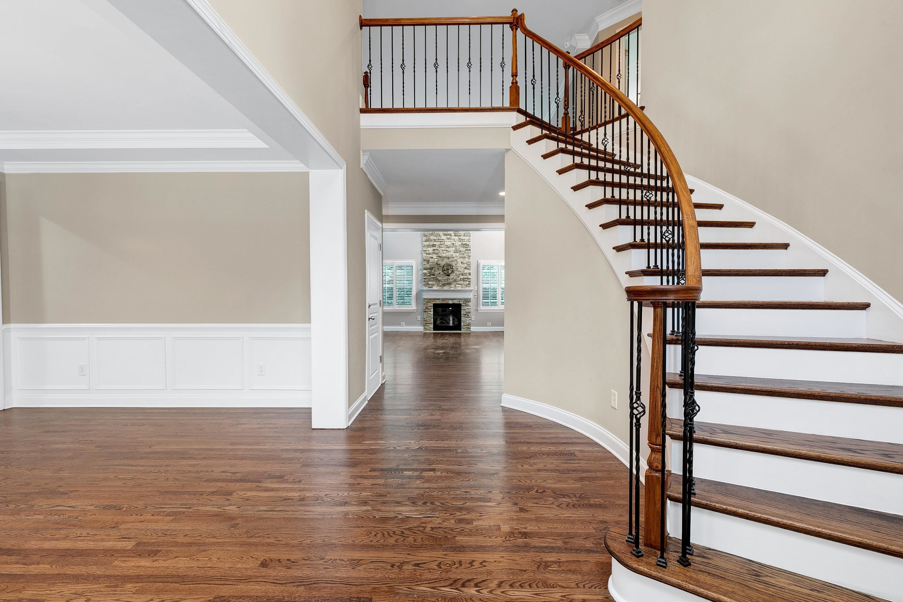 8431 Henderson Road Apex, NC 27539 - Photo 4 of 56 a view of entryway and hall with wooden floor