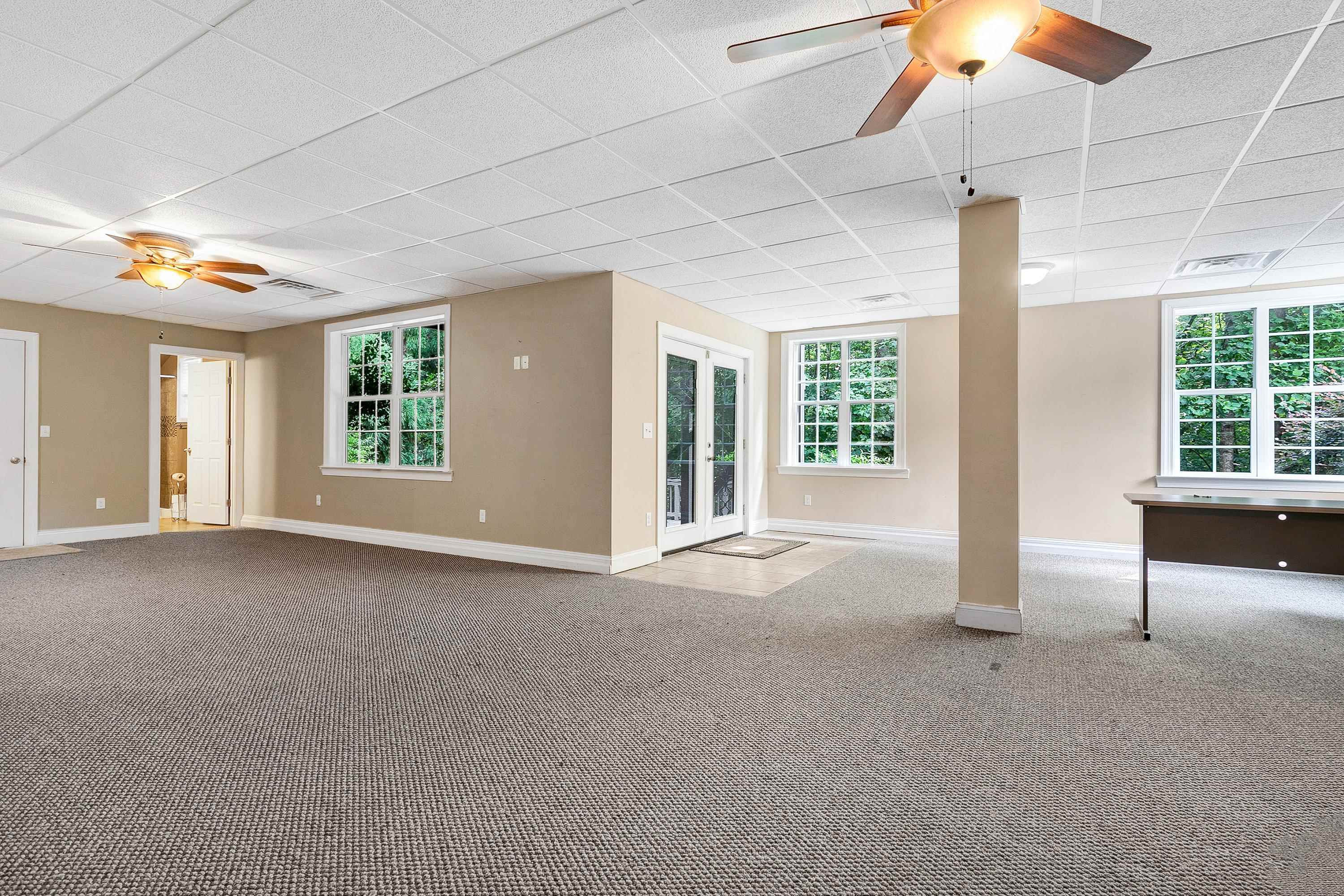8431 Henderson Road Apex, NC 27539 - Photo 41 of 56 a view of livingroom with hardwood floor and window