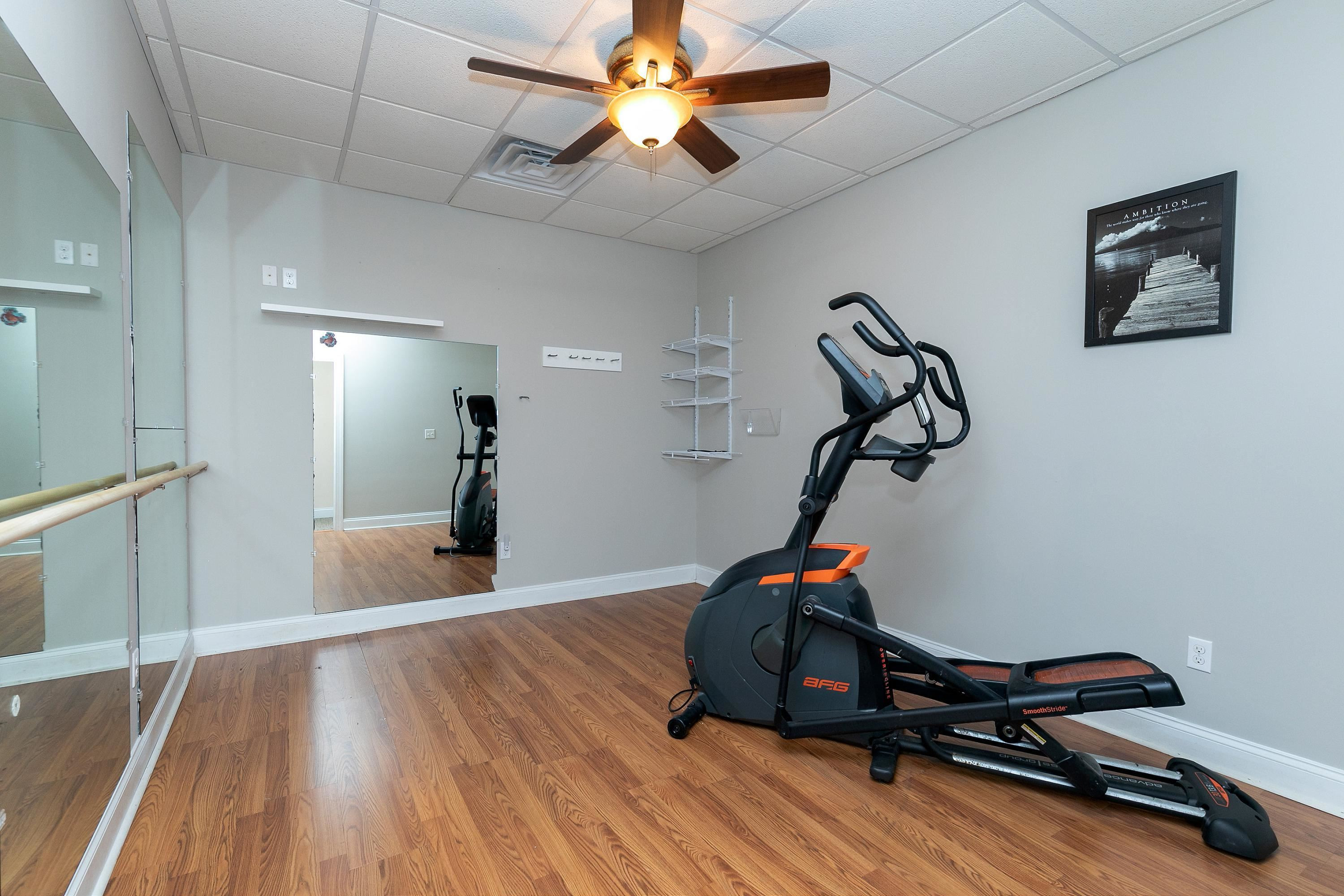 8431 Henderson Road Apex, NC 27539 - Photo 44 of 56 a view of a room with gym equipment