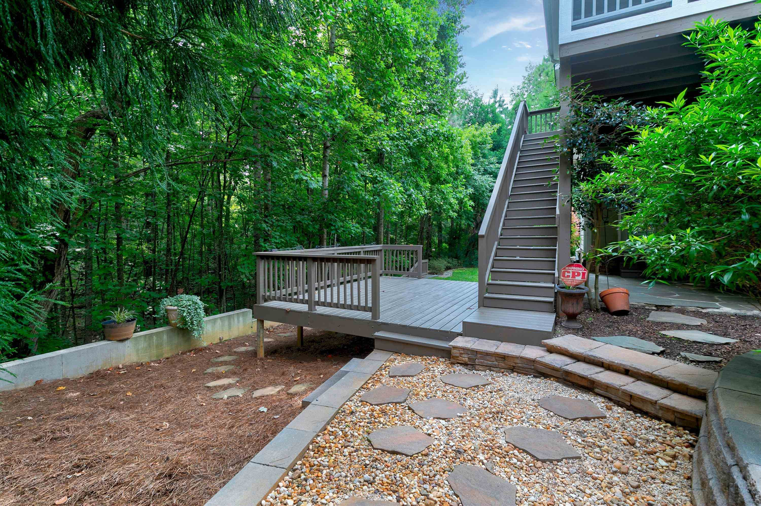 8431 Henderson Road Apex, NC 27539 - Photo 48 of 56 a view of a backyard with sitting area