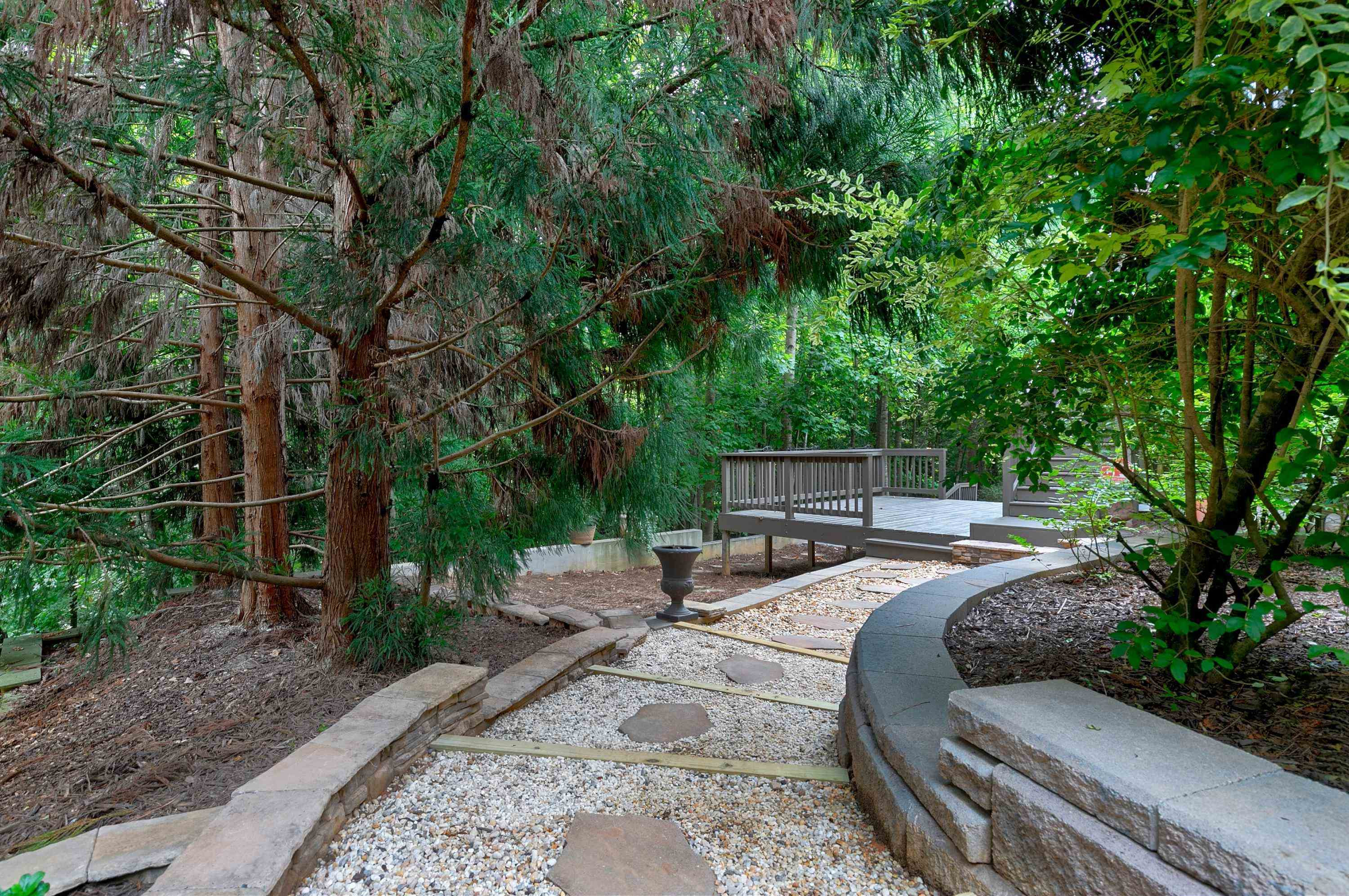 8431 Henderson Road Apex, NC 27539 - Photo 54 of 56 a view of backyard with seating area and green space