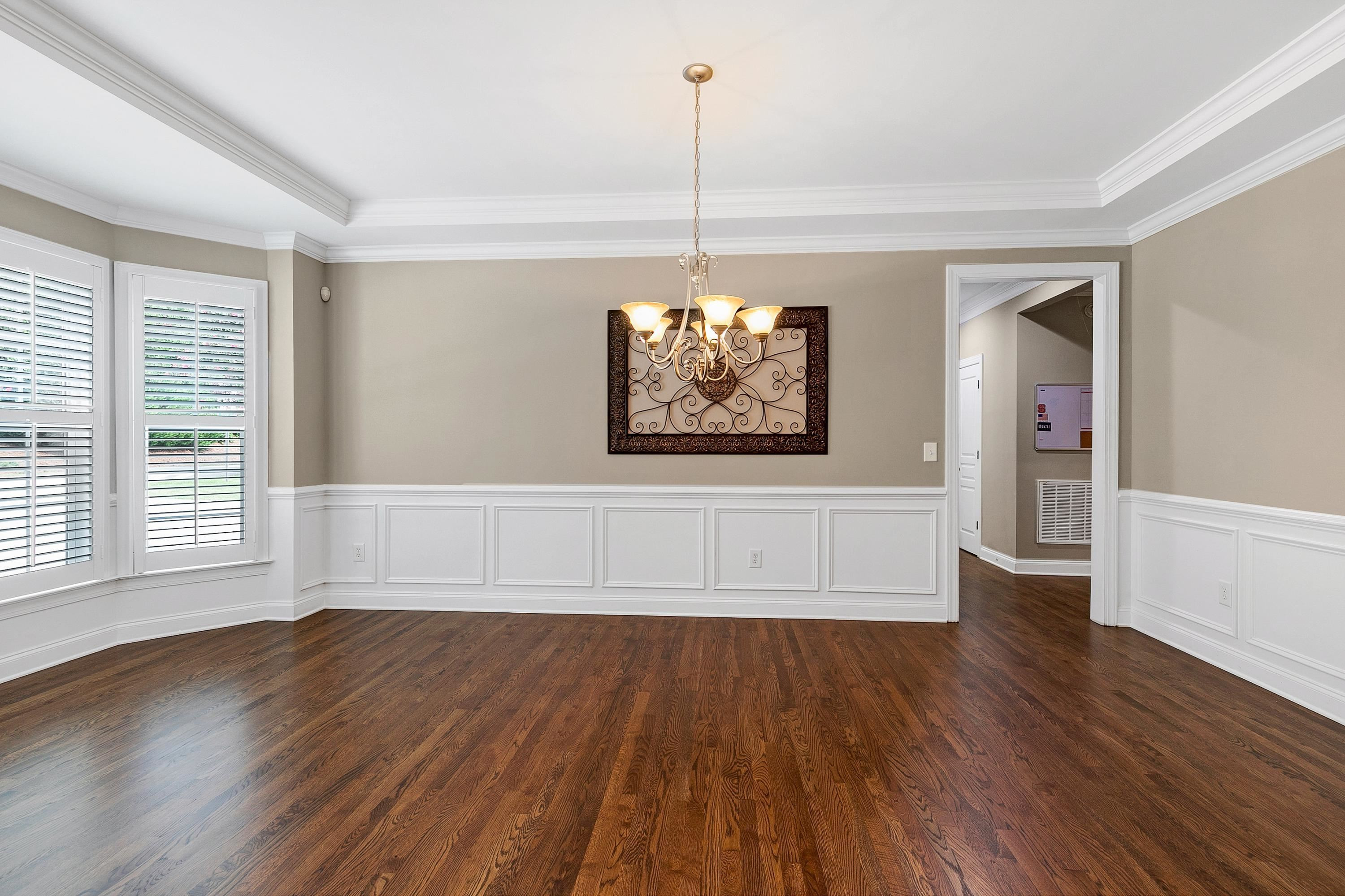 8431 Henderson Road Apex, NC 27539 - Photo 6 of 56 a view of empty room with wooden floor and fan
