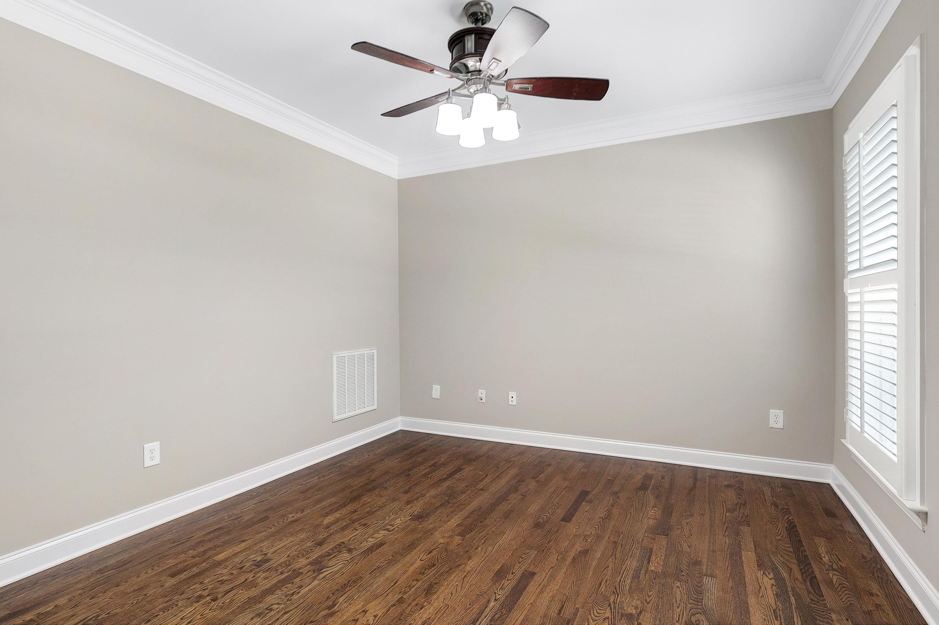 8431 Henderson Road Apex, NC 27539 - Photo 7 of 56 wooden floor in an empty room with a window