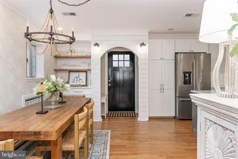 a dining room with wooden floor and breakfast area