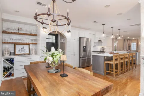 a kitchen with a refrigerator a sink and a stove