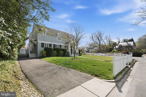 a view of a backyard with large trees