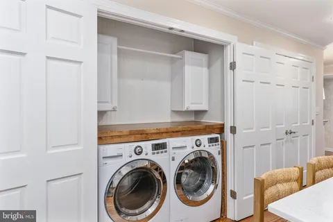 a bathroom with a shower sink and mirror