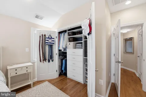 a bathroom with a white bath tub and a shower in a bathroom