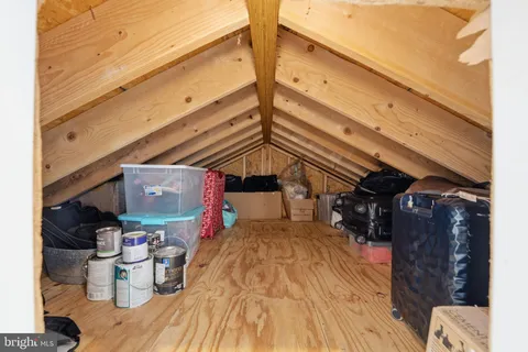 a bedroom with two beds and a dresser
