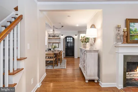 a view of a dining room with furniture wooden floor and chandelier