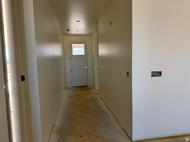 5005 North 75 East Enoch, UT 84721 - Photo 7 of 37 Hallway with unfinished concrete floors