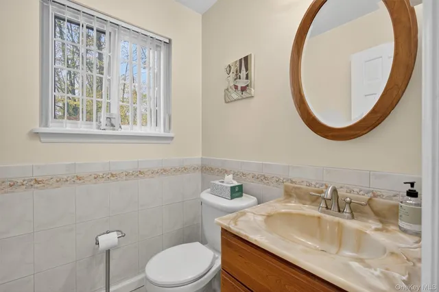 a spacious bathroom with a sink and a mirror