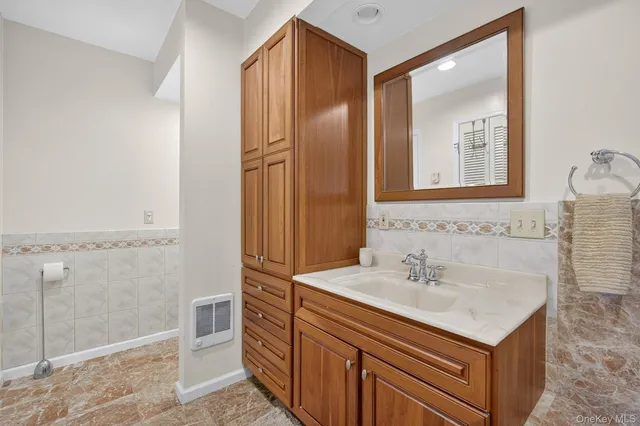 a bathroom with a sink and a shower