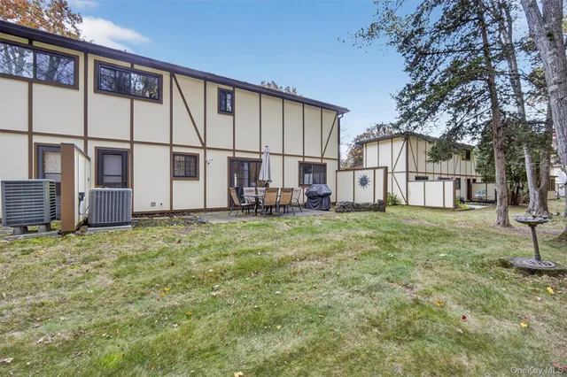 a bedroom with a bed and painting on the wall