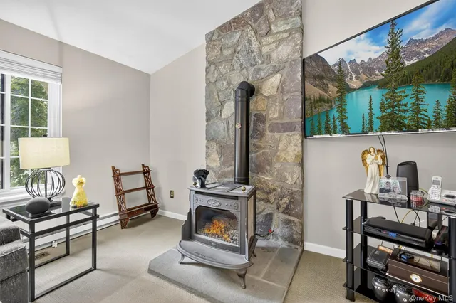 a living room with furniture and a clock