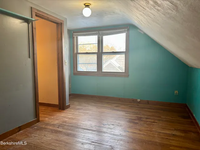 an empty room with sliding door and door