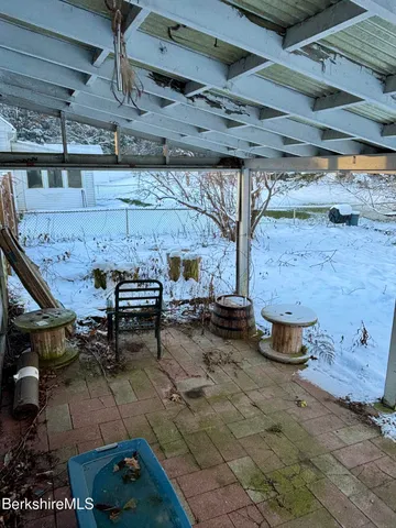 a view of backyard with outdoor seating