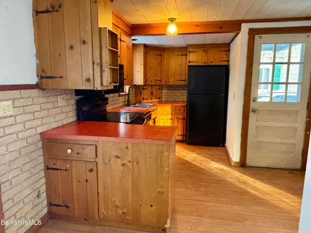 a view of a refrigerator in the kitchen