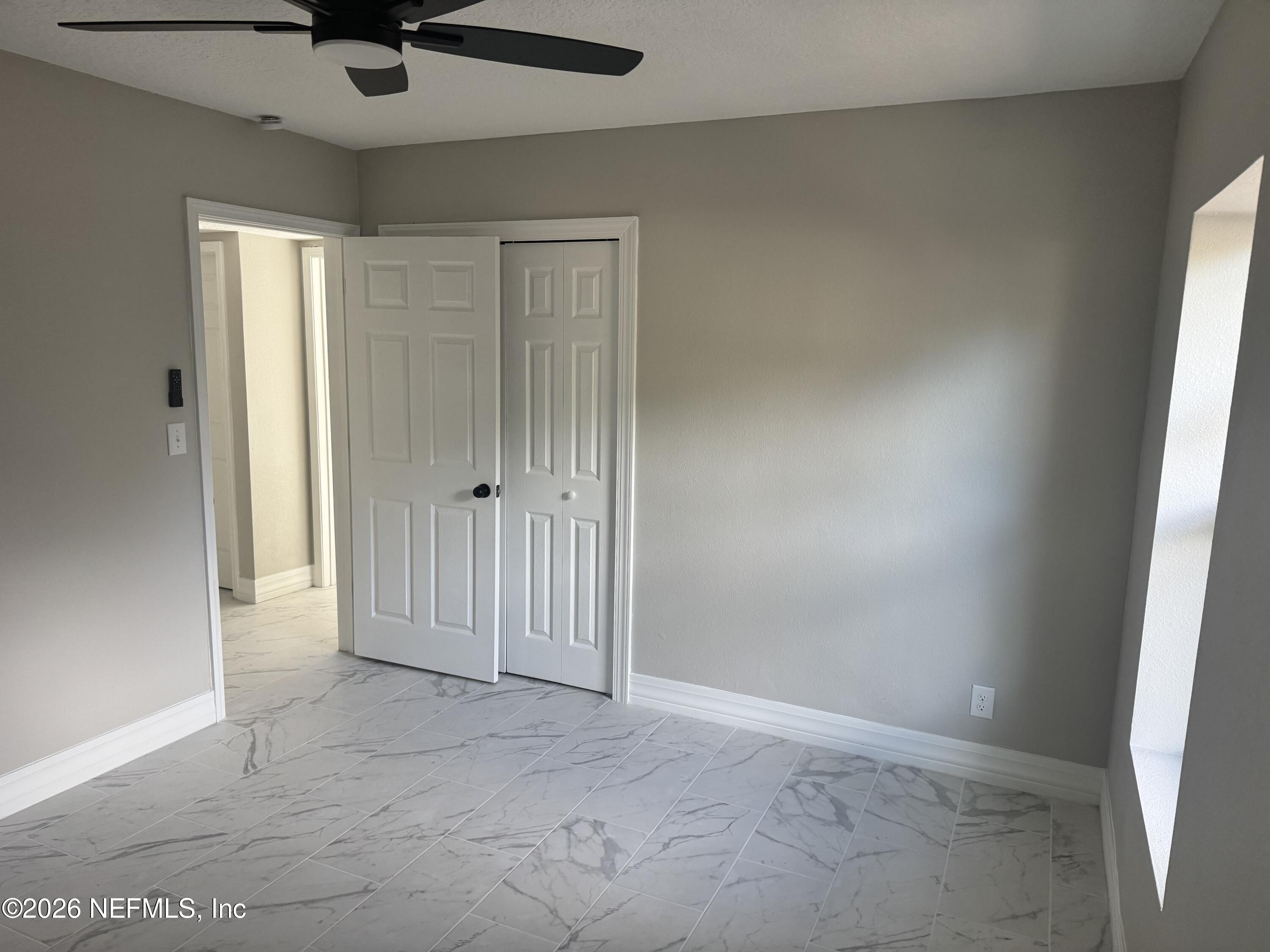 1718 Cornell Road Jacksonville, FL 32207 - Photo 34 of 41 an empty room with a window