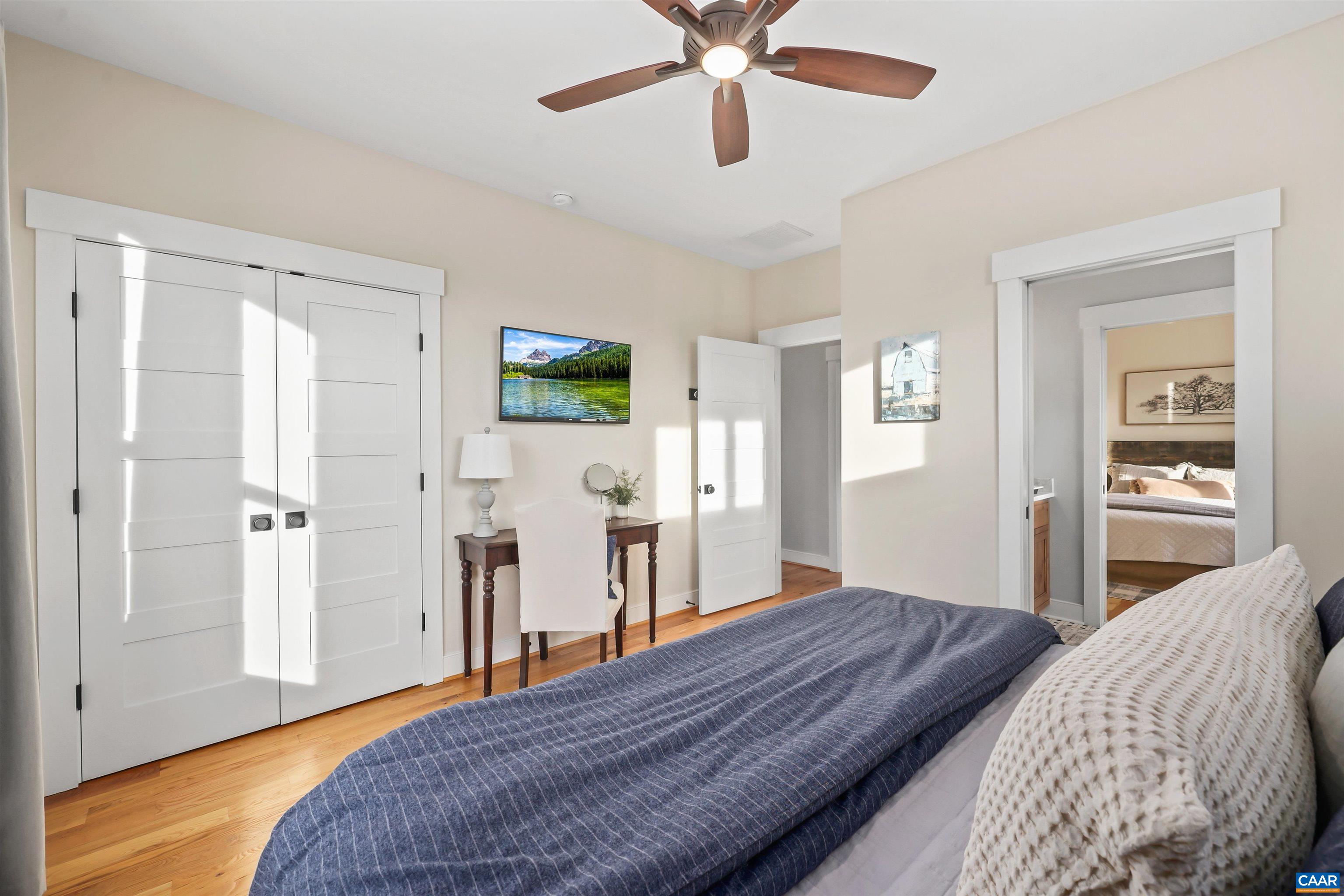 5797 Advance Mills Road Advance Mills, VA 22968 - Photo 29 of 70 a bedroom with a bed and a chandelier