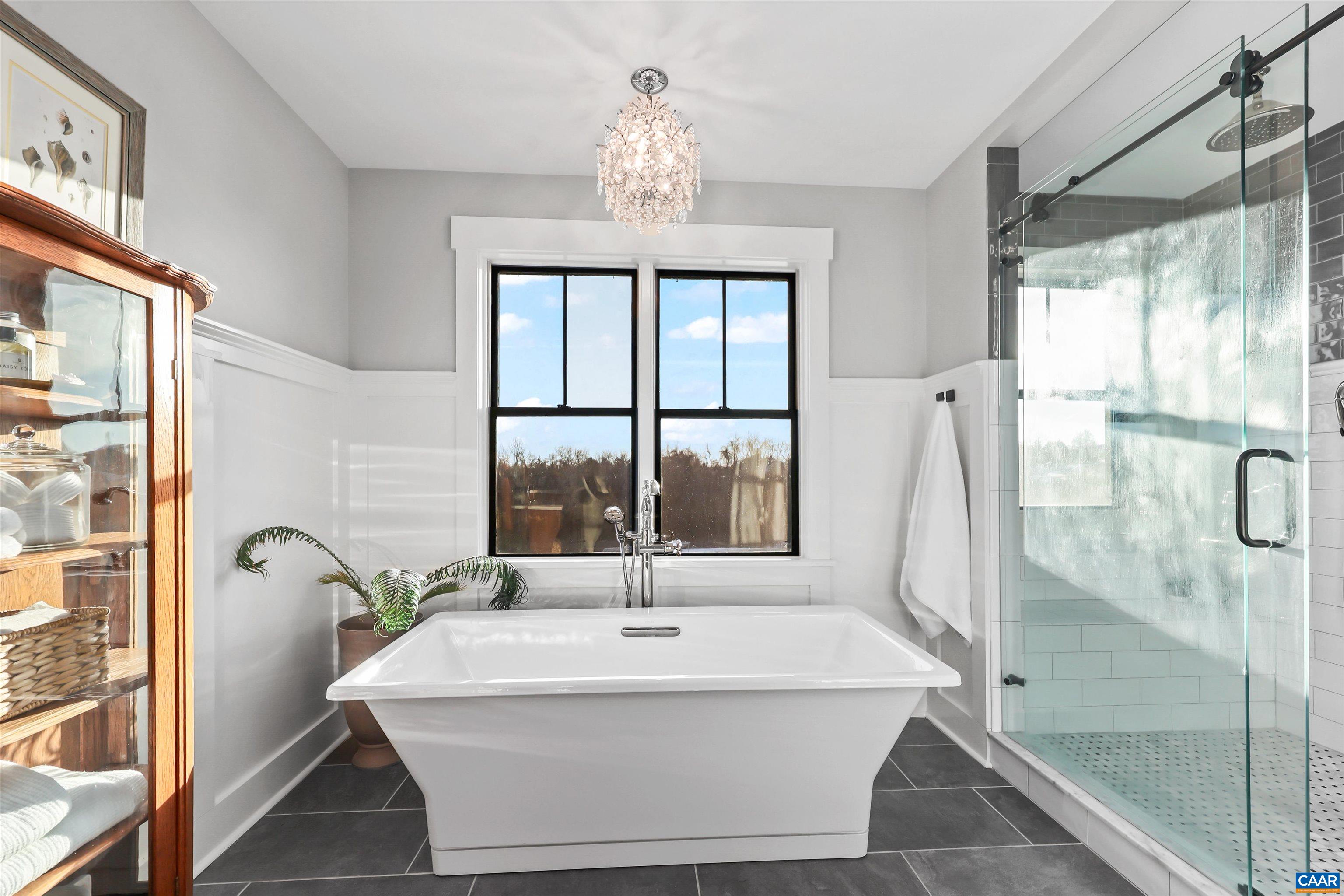 5797 Advance Mills Road Advance Mills, VA 22968 - Photo 43 of 70 a white bath tub sitting next to a window