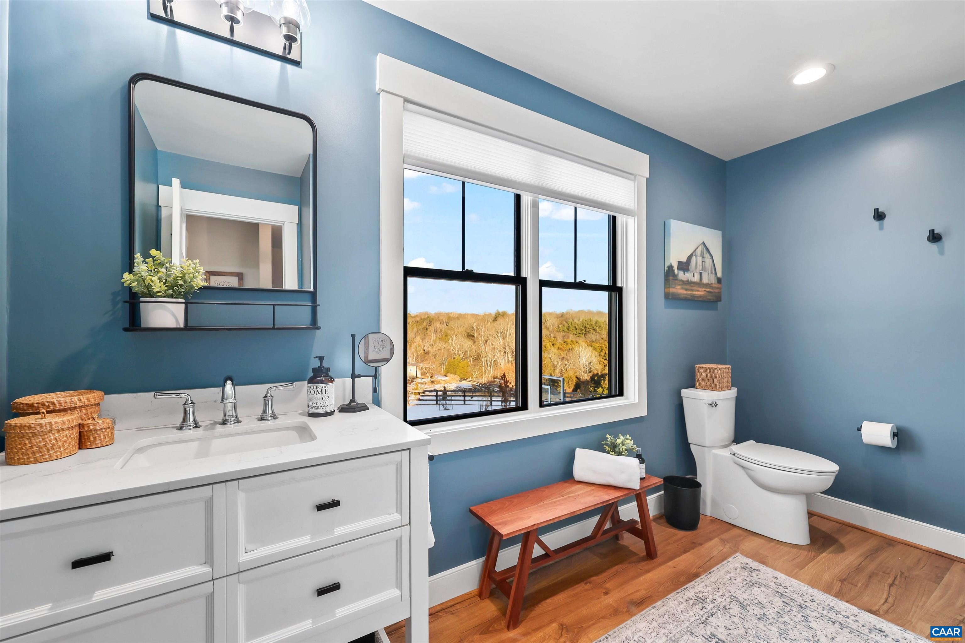 5797 Advance Mills Road Advance Mills, VA 22968 - Photo 50 of 70 a bathroom with a toilet sink a window and mirror