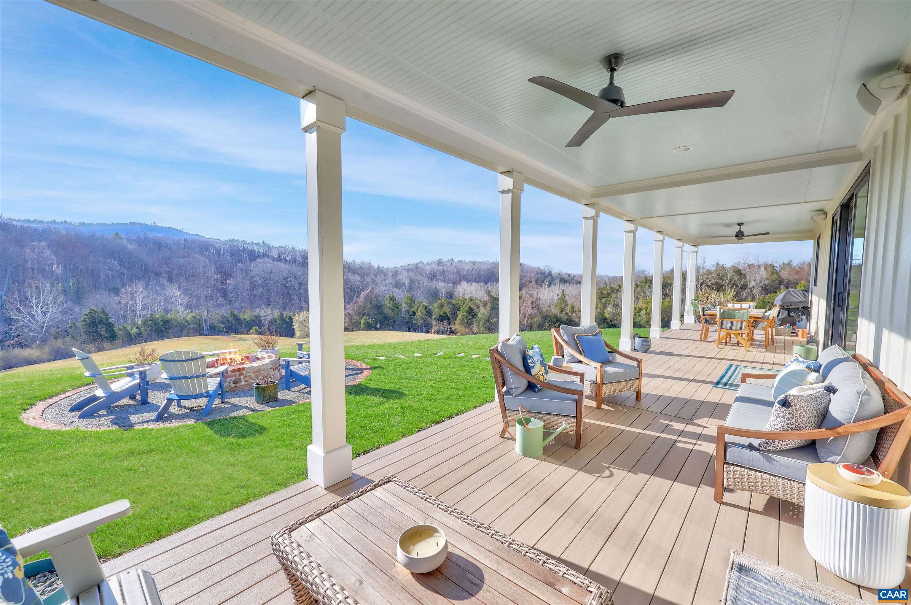 5797 Advance Mills Road Advance Mills, VA 22968 - Photo 54 of 70 a view of a patio with a table chairs and a yard