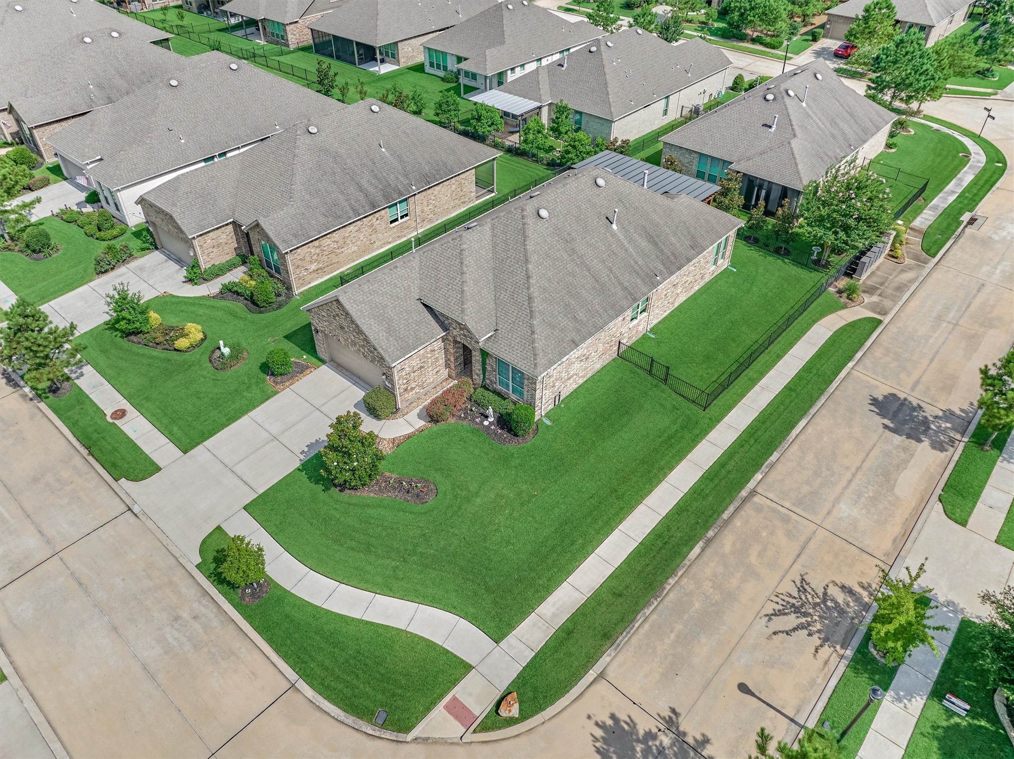 108 Wild Wick Way Spring, TX 77382 - Photo 4 of 44 The Home Is Situated On A Beautiful Corner Lot With Iron Fencing And Access To The Network Of Sidewalks Just Outside The Front Door; Perfect For An Evening Stroll!