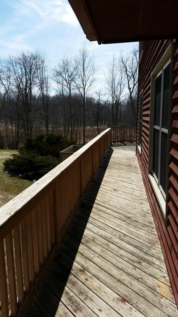 4630 Cedar Lake Road Howell, MI 48843 - Photo 24 of 31 porch wraps to back
