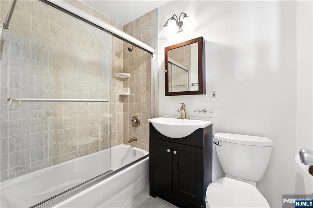 6600 JFK Boulevard East, Unit 18L West New York, NJ 07093 - Photo 16 of 36 a bathroom with a sink toilet and shower