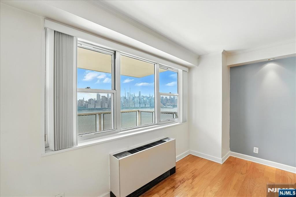 6600 JFK Boulevard East, Unit 18L West New York, NJ 07093 - Photo 2 of 36 a view of an empty room with a window