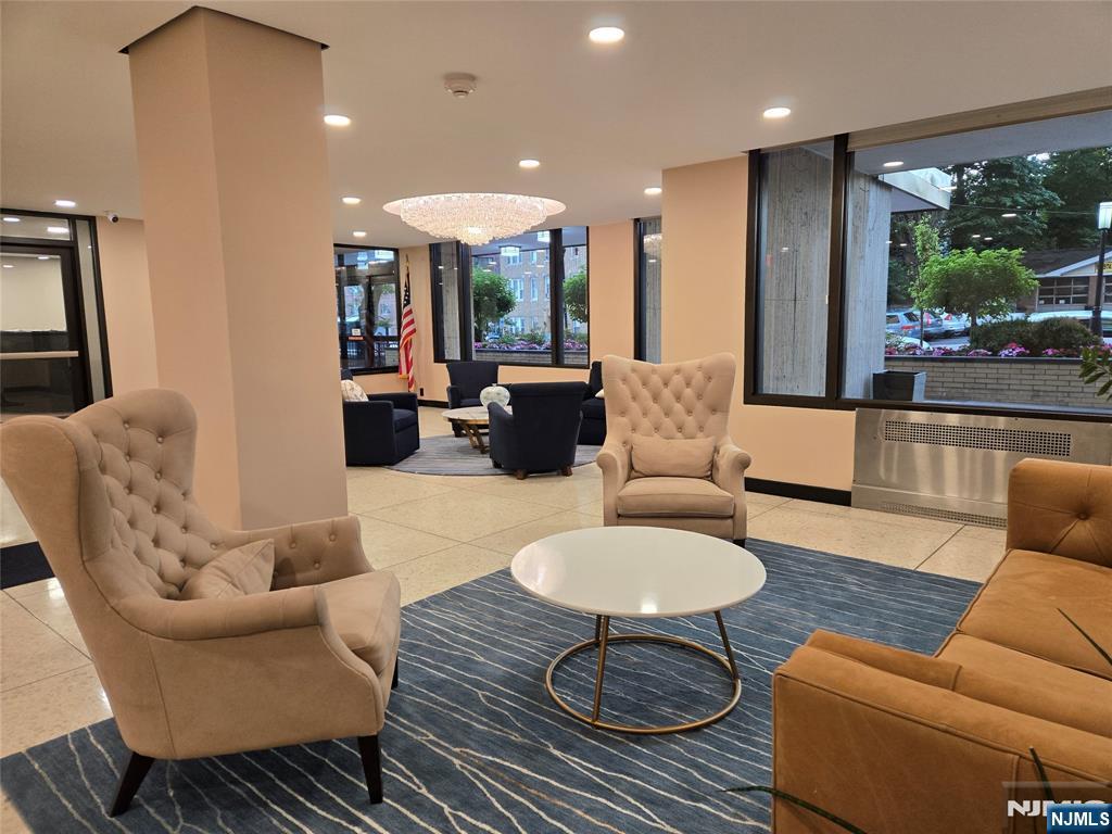 6600 JFK Boulevard East, Unit 18L West New York, NJ 07093 - Photo 33 of 36 a living room with furniture and a large window