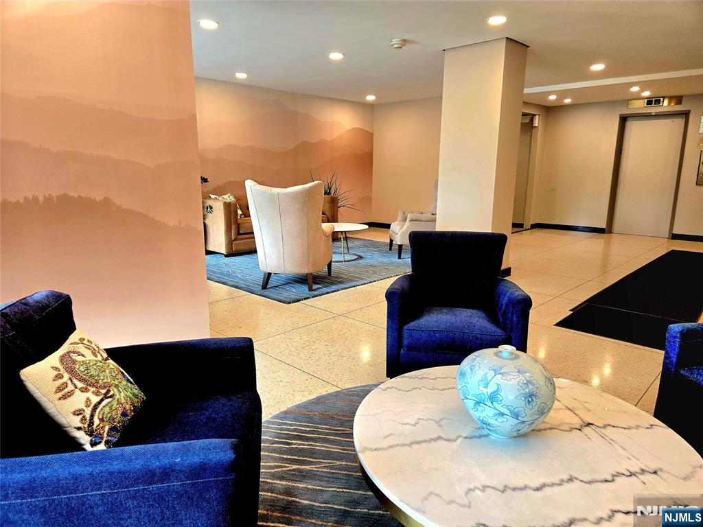 6600 JFK Boulevard East, Unit 18L West New York, NJ 07093 - Photo 34 of 36 a living room with furniture and wooden floor