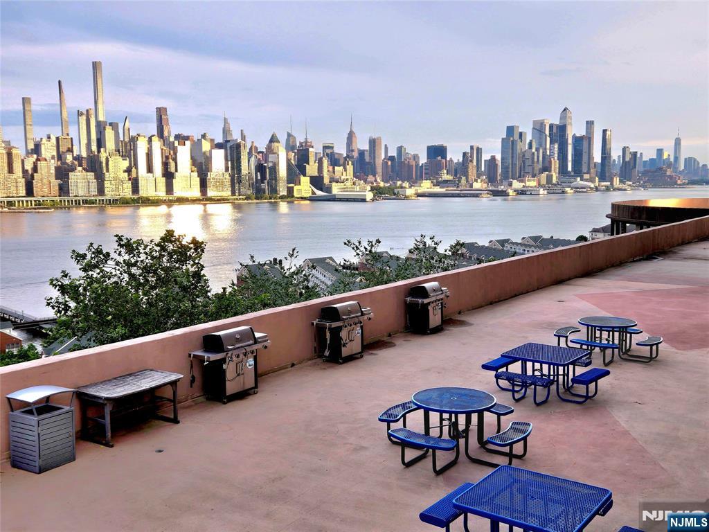 6600 JFK Boulevard East, Unit 18L West New York, NJ 07093 - Photo 8 of 36 a view of a terrace with chairs