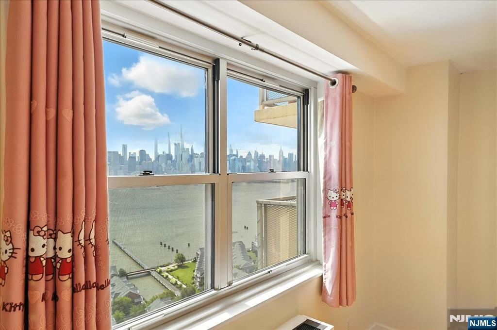 6600 JFK Boulevard East, Unit 18L West New York, NJ 07093 - Photo 9 of 36 a view of a glass door and a window
