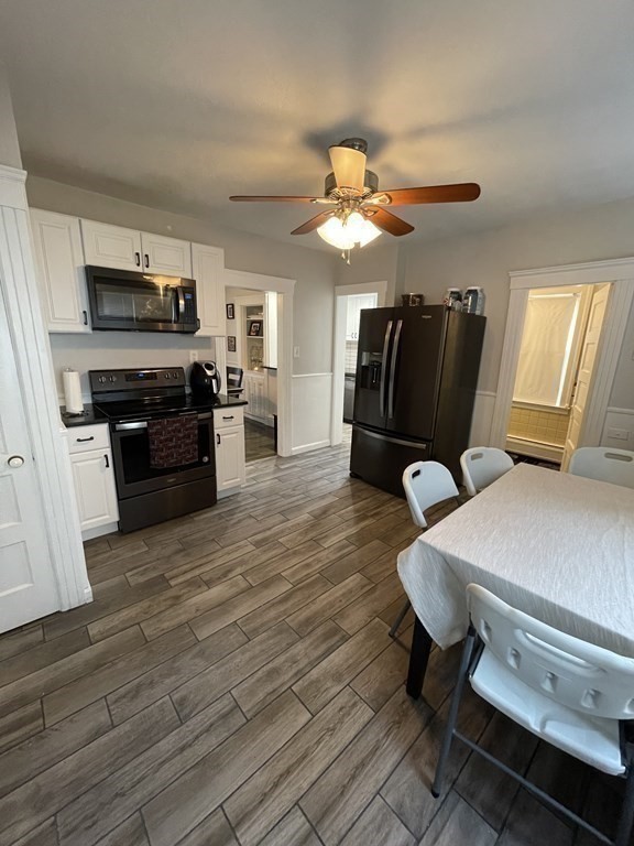 9 Thayer Street Worcester, MA 01603 - Photo 3 of 18 a living room with furniture and flat screen tv