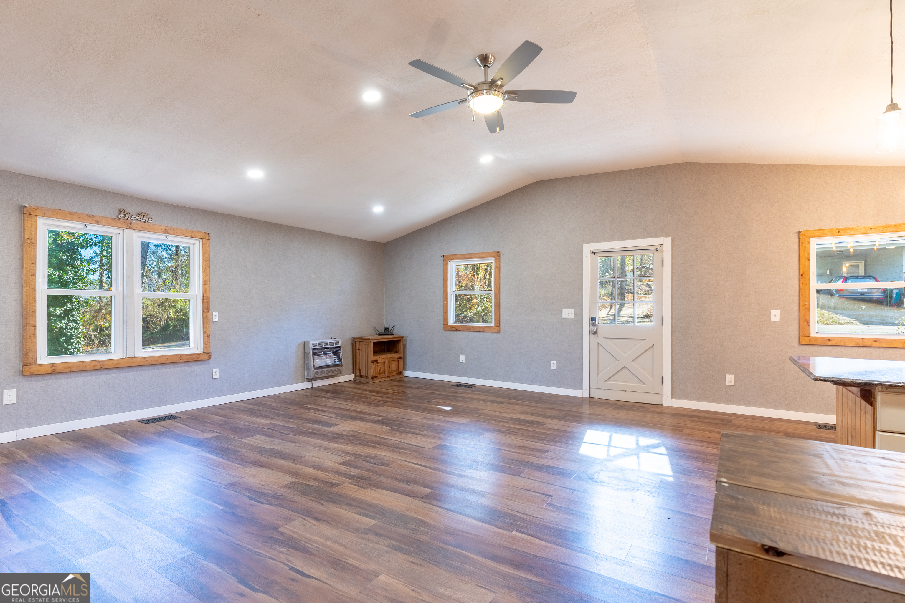 139 Cherokee Drive Jackson, GA 30233 - Photo 12 of 34 a view of an empty room with window and wooden floor