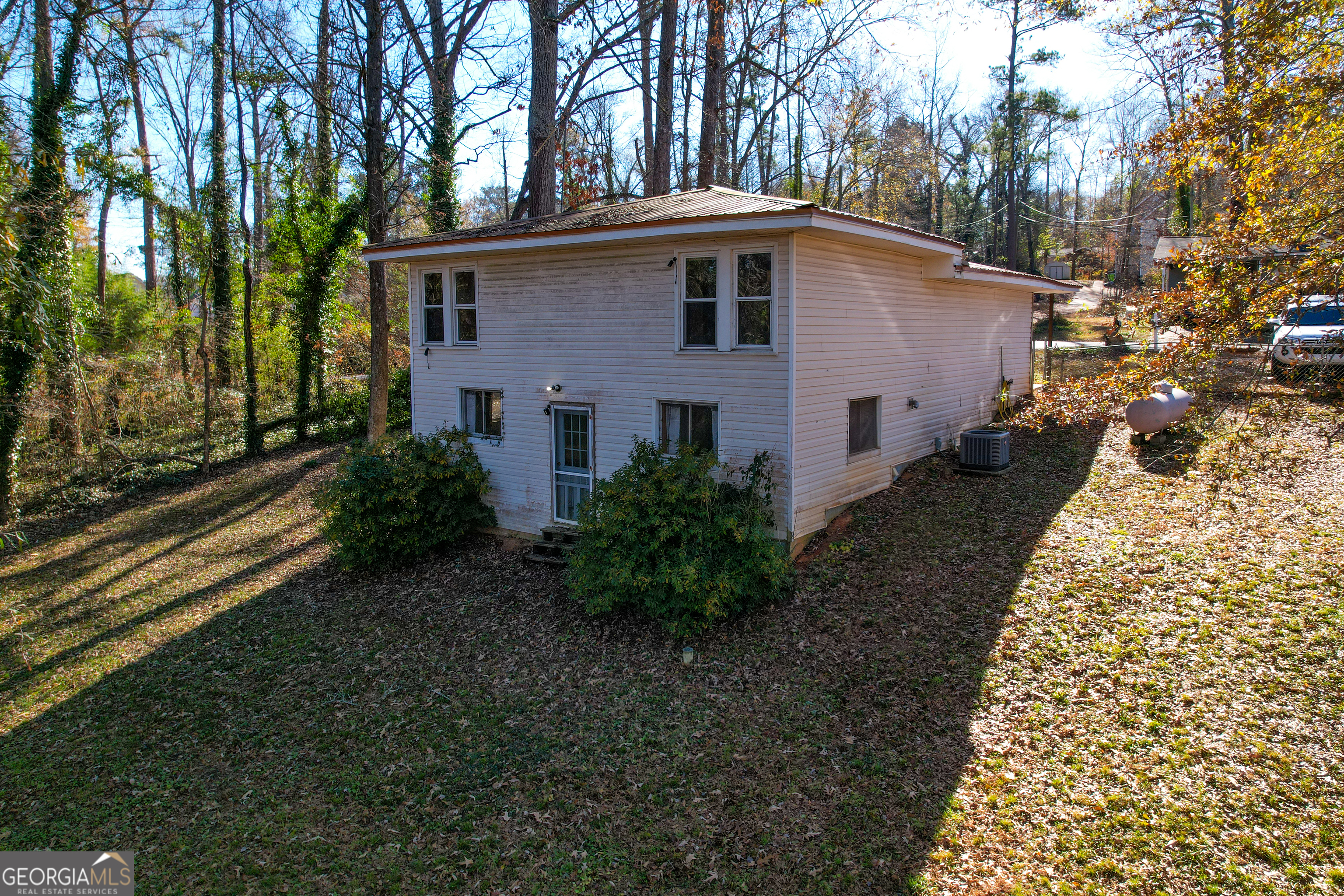 139 Cherokee Drive Jackson, GA 30233 - Photo 22 of 34 a front view of a house with garden